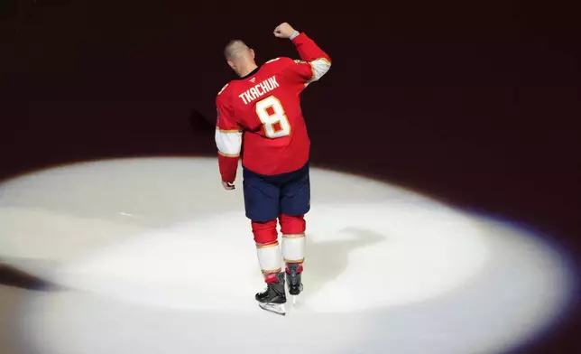Florida Panthers left wing Brady Tkachuk (8) acknowledges the crowd after scoring the game winning goal during overtime in an NHL hockey game against the Vancouver Canucks, Thursday, Oct. 15, 2026, in Sunrise, Fla. (AP Photo/Lynne Sladky)