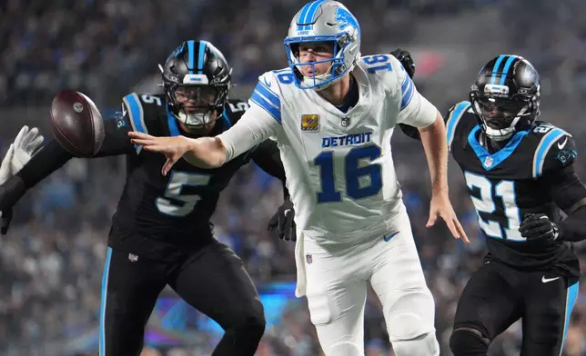 Detroit Lions quarterback Jared Goff (16) passes the ball during an NFL football game against the Carolina Panthers in Charlotte, N.C., Sunday, Oct. 4, 2026. (AP Photo/Jacob Kupferman)
