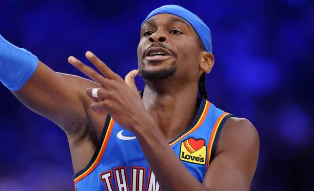 Oklahoma City Thunder guard Shai Gilgeous-Alexander gestures after making a basket during the second half of an NBA basketball game against the Denver Nuggets, Thursday, Oct. 22, 2026, in Oklahoma City. (AP Photo/Nate Billings)