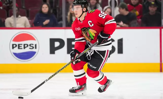 Chicago Blackhawks center Connor Bedard (98) skates during the first period of an NHL hockey game against the Winnipeg Jets, Thursday, Oct. 15, 2026, in Chicago. (AP Photo/Harry Figiel)