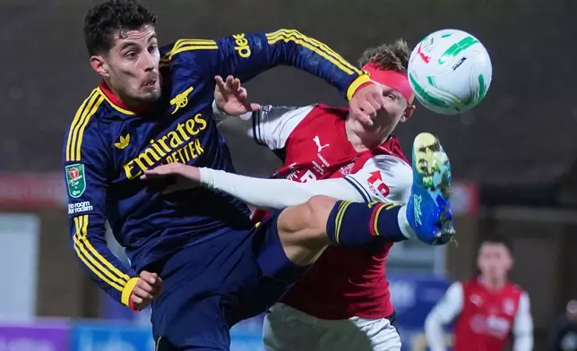 Arsenal's Kai Havertz, left, challenges for the ball with Fleetwood's Finley Potter during the English League Cup soccer match between Fleetwood Town and Arsenal in Fleetwood, England, Tuesday, Oct. 27, 2026. (AP Photo/Ian Hodgson)