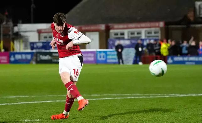 Fleetwood’s Conor Haughey scores the winning penalty kick in shootout during the English League Cup soccer match between Fleetwood Town and Arsenal in Fleetwood, England, Tuesday, Oct. 27, 2026. (Nick Potts/PA via AP)
