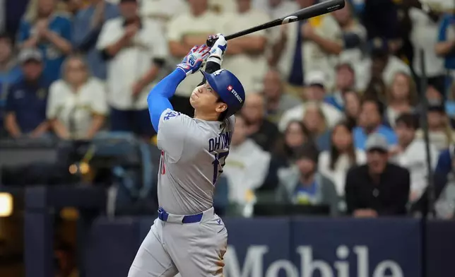 Los Angeles Dodgers designated hitter Shohei Ohtani pops up for an out during the eighth inning of Game 1 of baseball's National League Championship Series between the Milwaukee Brewers and the Los Angeles Dodgers, Sunday, Oct. 11, 2026, in Milwaukee. (AP Photo/Abbie Parr)