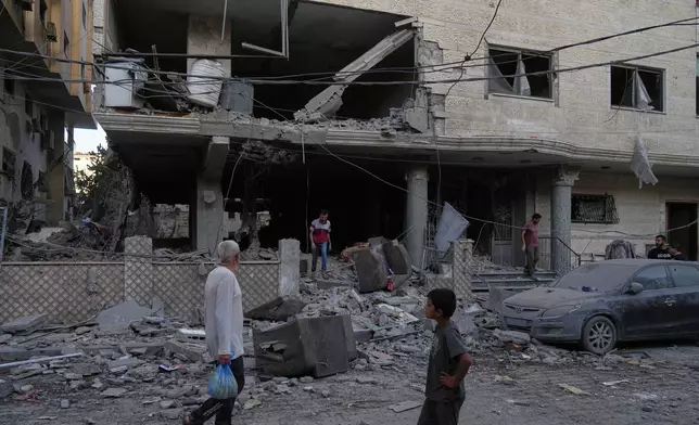 Palestinians inspect the site of an early morning Israeli airstrike in Gaza city, Saturday, Oct. 3, 2026. (AP Photo/Jehad Alshrafi)