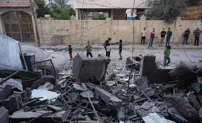 Palestinians inspect the site of an early morning Israeli airstrike in Gaza city, Saturday, Oct. 3, 2026. (AP Photo/Jehad Alshrafi)