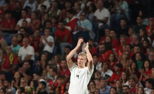Norway's Erling Haaland applauds the fans when leaving the pitch after being substituted during the Nations League soccer match between Portugal and Norway in Porto, Portugal, Sunday, Oct. 4, 2026. (AP Photo/Luis Vieira)