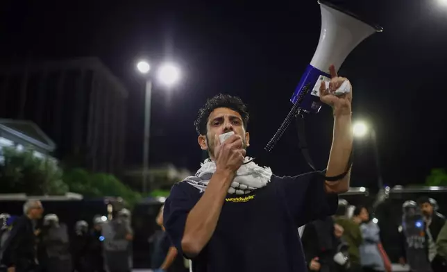 A protester chants slogans during a demonstration against the official visit of U.S. Secretary of State Marco Rubio to Athens, late Tuesday, Oct. 6, 2026. (AP Photo/Ismini Vlassopoulou)