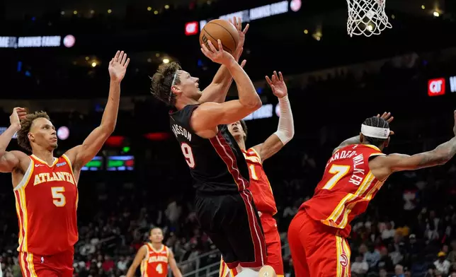 Miami Heat guard Pelle Larsson (9) shoots against the Atlanta Hawks during the second half of an NBA basketball game, Wednesday, Oct. 28, 2026, in Atlanta. (AP Photo/Mike Stewart)