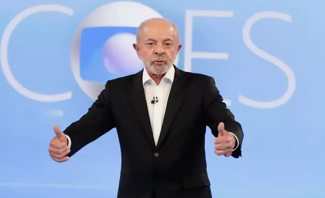 Brazilian President Luiz Inacio Lula da Silva, who is running for reelection, gestures during a televised presidential debate days before the presidential runoff election in Rio de Janeiro, Friday, Oct. 23, 2026. (AP Photo/Bruna Prado)