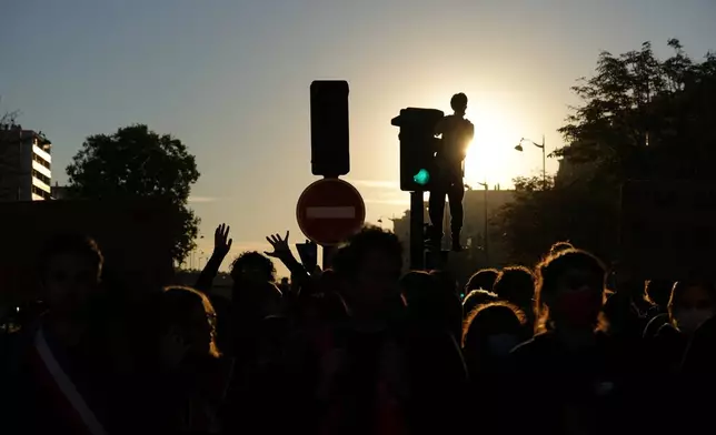 Students gather on the street before a demonstration against under-resourced schools, in Paris, Tuesday, Oct. 6, 2026. (AP Photo/Aurelien Morissard)