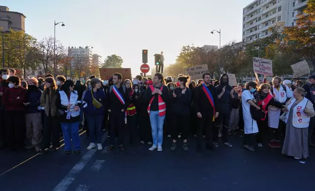 Students gather on the street before a demonstration against under-resourced schools, in Paris, Tuesday, Oct. 6, 2026. (AP Photo/Aurelien Morissard)