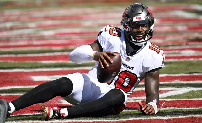 Tampa Bay Buccaneers quarterback Jalon Daniels (10) lies in the end zone after he was sacked during the second half of an NFL football game against the Green Bay Packers in Tampa, Fla., Sunday, Oct. 4, 2026. (AP Photo/Jason Behnken)