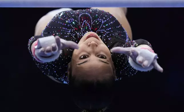 Sihem Hamidi, of Algeria, competes in the uneven bars during the women's qualifications at the Artistic Gymnastics World Championships in Rotterdam, the Netherlands, Monday, Oct. 19, 2026. (AP Photo/Francisco Seco)