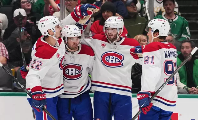 Montréal Canadiens' Chris Kreider (22), Alex Newhook (15), Noah Dobson (53) and Oliver Kapanen (91) celebrate after Newhook scored against the Dallas Stars in the second period of an NHL hockey game in Dallas, Thursday Oct. 29, 2026. (AP Photo/Tony Gutierrez)