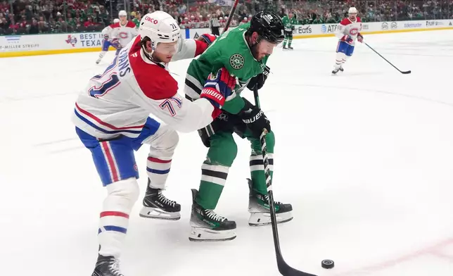 Montréal Canadiens' Jake Evans (71) and Dallas Stars' Tyler Seguin, right, compete in the first period of an NHL hockey game in Dallas, Thursday Oct. 29, 2026. (AP Photo/Tony Gutierrez)