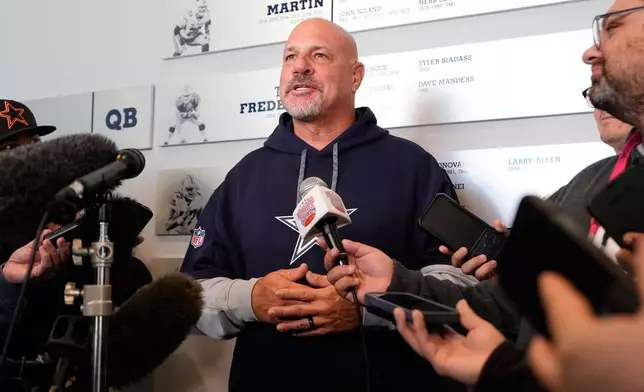 Mike Pettine, the Dallas Cowboys senior defensive assistant, responds to questions during a news conference after a practice at the NFL football team's headquarters, Friday, Oct. 16, 2026, in Frisco, Texas. (AP Photo/Tony Gutierrez)
