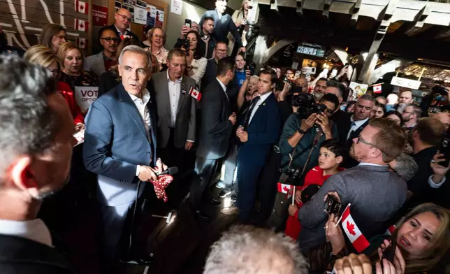 Prime Minister Mark Carney attends a national unity rally in Red Deer, on Friday Oct. 16, 2026. (John Ulan/The Canadian Press via AP)