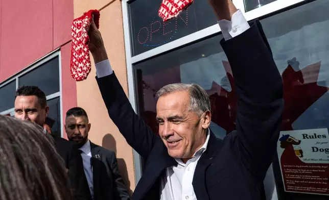 Prime Minister Mark Carney attends a national unity rally in Red Deer, on Friday Oct. 16, 2026. (John Ulan/The Canadian Press via AP)