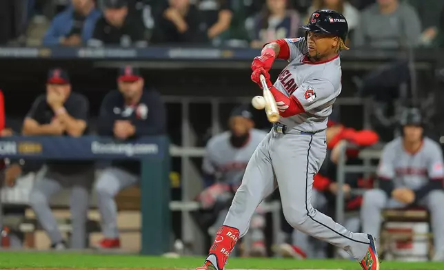 Cleveland Guardians' Jose Ramirez hits a 2-run home run during the fifth inning in Game 4 of baseball's American League Division Series against the Chicago White Sox, Thursday, Oct. 8, 2026, in Chicago. (AP Photo/Melissa Tamez)