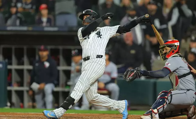 Chicago White Sox's Miguel Vargas watches his solo home run during the ninth inning in Game 4 of baseball's American League Division Series against the Cleveland Guardians, Thursday, Oct. 8, 2026, in Chicago. (AP Photo/Melissa Tamez)