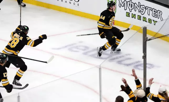 Boston Bruins forward James Hagens (44) celebrates after scoring a third-period goal during an NHL hockey game against the San Jose Sharks, Saturday, Oct. 24, 2026, in Boston. (AP Photo/Jim Davis)