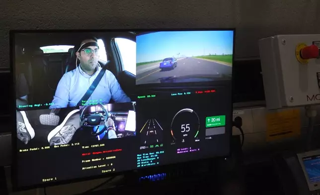 In this image from video, a control room display shows data and video from a simulated drive taking place at General Motors' Global Technical Center Friday, Sept. 18, 2026, in Warren, Mich. (AP Photo/Mike Householder)