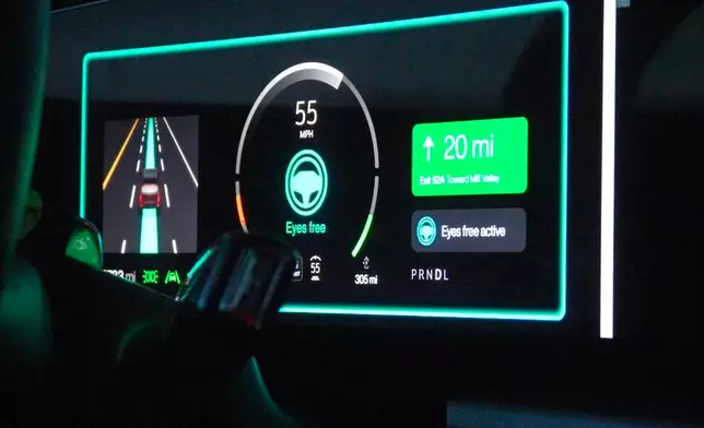 In this image from video, a display screen on the dashboard of a Cadillac Lyriq indicates the vehicle is in "Eyes free active" mode during a simulated drive at General Motors' Global Technical Center Friday, Sept. 18, 2026, in Warren, Mich. (AP Photo/Mike Householder)