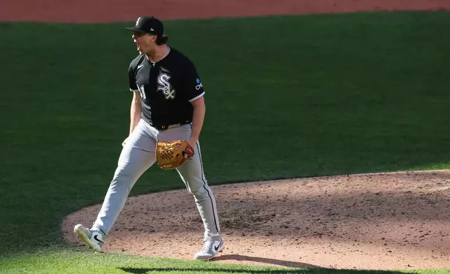 Chicago White Sox relief pitcher Grant Taylor reacts to a win over the Cleveland Guardians in Game 1 of baseball's American League Division Series, Saturday, Oct. 3, 2026, in Cleveland. (AP Photo/Tim Phillis)