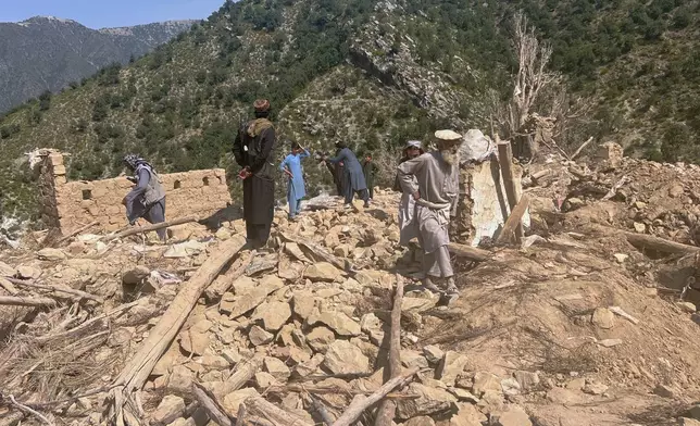 Local residents search through rubble after what Afghanistan's Taliban government said was an overnight Pakistani strike on a house in a village in Shaltan district of eastern Kunar province, Afghanistan, Thursday, Oct. 1, 2026. (AP Photo/Hedayat Shah)