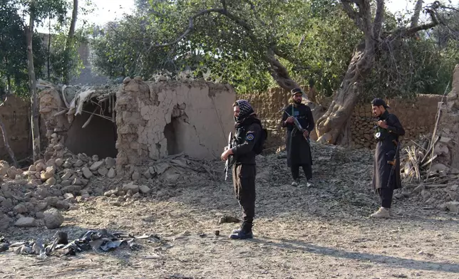 Taliban security officers inspect the scene of what Taliban officials said were Pakistani airstrikes in Khost province, Afghanistan, Thursday, Sept. 24, 2026. (AP Photo/Saifullah Zahir)