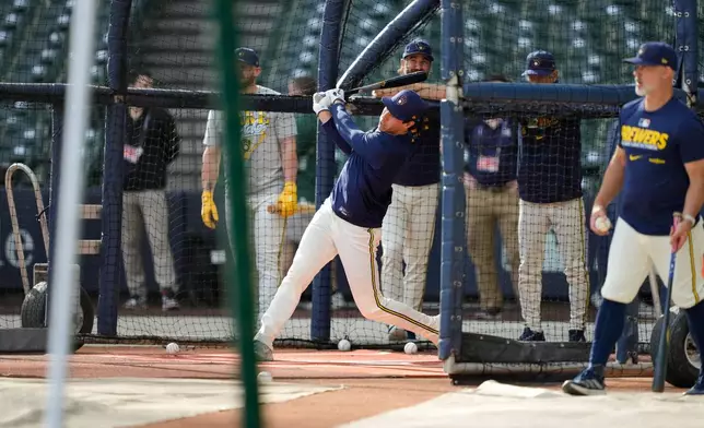 Milwaukee Brewers designated hitter Christian Yelich takes batting practice ahead of Game 1 of baseball's National League Championship Series between the Milwaukee Brewers and the Los Angeles Dodgers, Saturday, Oct. 10, 2026, in Milwaukee. (AP Photo/Kyla Wolf)