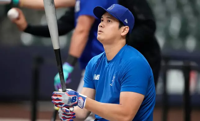 Los Angeles Dodgers two-way player Shohei Ohtani works out ahead of Game 1 of baseball's National League Championship Series between the Milwaukee Brewers and the Los Angeles Dodgers, Saturday, Oct. 10, 2026, in Milwaukee. (AP Photo/Kyla Wolf)