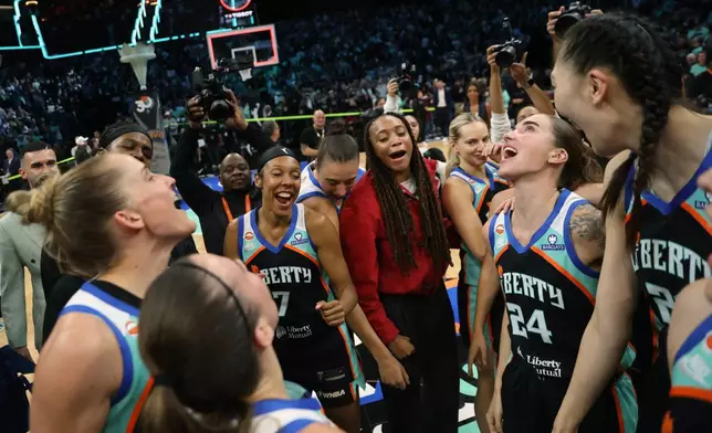 New York Liberty players huddle after winning Game 2 of a WNBA basketball first-round playoff series against the Minnesota Lynx, Tuesday, Sept. 29, 2026, in New York. (AP Photo/Heather Khalifa)
