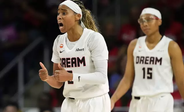 Atlanta Dream guard Jordin Canada, left, reacts after committing a foul against the Washington Mystics during the second half in Game 2 of a WNBA basketball first-round playoff series, Wednesday, Sept. 30, 2026, in Washington. (AP Photo/Stephanie Scarbrough)