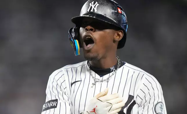 New York Yankees' Jazz Chisholm Jr. reacts after hitting a single against the Boston Red Sox during the sixth inning in Game 2 of baseball's American League Wild Card Series, Wednesday, Sept. 30, 2026, in New York. (AP Photo/Yuki Iwamura)