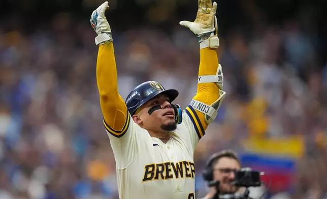 Milwaukee Brewers catcher William Contreras celebrates his home run during the fifth inning of Game 2 of baseball's National League Championship Series between the Milwaukee Brewers and the Los Angeles Dodgers, Monday, Oct. 12, 2026, in Milwaukee. (AP Photo/Abbie Parr)