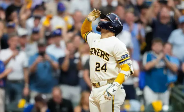 Milwaukee Brewers catcher William Contreras celebrates his solo home run during the fifth inning of Game 2 of baseball's National League Championship Series between the Milwaukee Brewers and the Los Angeles Dodgers, Monday, Oct. 12, 2026, in Milwaukee.(AP Photo/Ashley Landis)
