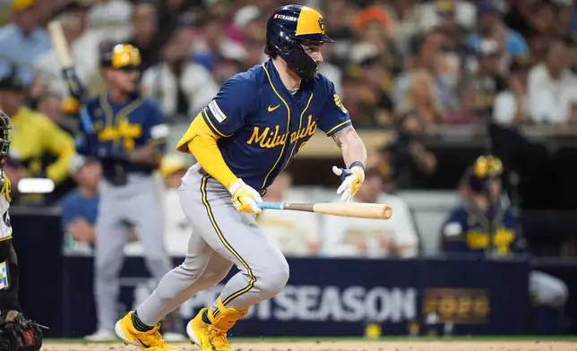 Milwaukee Brewers' Garrett Mitchell watches after hitting an RBI single against the San Diego Padres during the third inning in Game 4 of baseball's National League Division Series Wednesday, Oct. 7, 2026, in San Diego. (AP Photo/Gregory Bull)