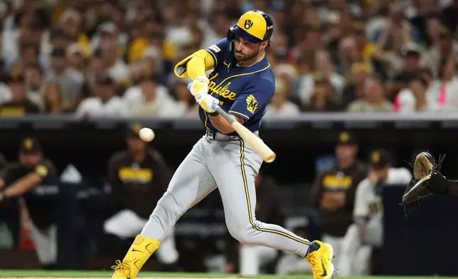 Milwaukee Brewers' Garrett Mitchell hits an RBI single against the San Diego Padres during the third inning in Game 4 of baseball's National League Division Series Wednesday, Oct. 7, 2026, in San Diego. (AP Photo/Derrick Tuskan)