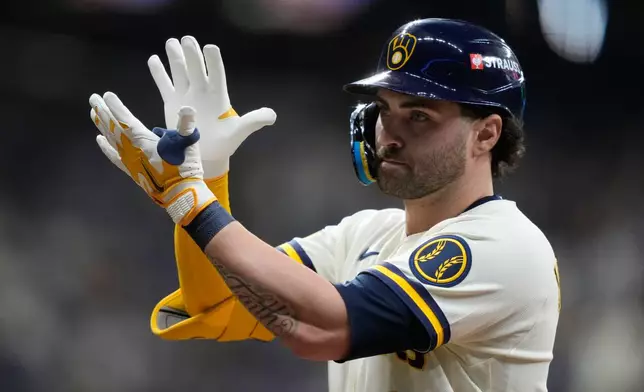 Milwaukee Brewers' Garrett Mitchell reacts after hitting a single during the third inning in Game 1 of a National League Divisional baseball playoff series against the San Diego Padres Saturday, Oct. 3, 2026, in Milwaukee. (AP Photo/Kayla Wolf)