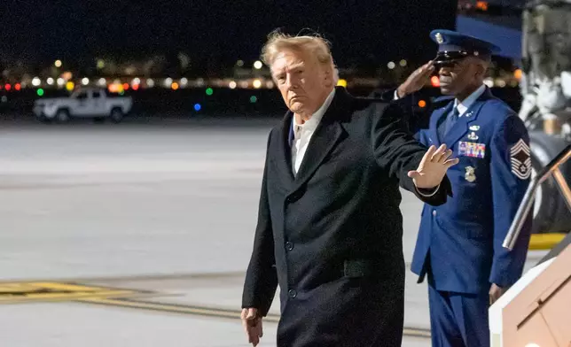 President Donald Trump waves as he arrives at Harry Reid International Airport, Wednesday, Oct. 14, 2026, in Las Vegas, Nev. (AP Photo/Alex Brandon)