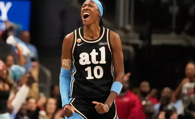 Atlanta Dream guard Rhyne Howard (10) celebrates scoring during the first half of Game 3 of the WNBA basketball finals against the Golden State Valkyries on Wednesday, Oct. 21, 2026, in Atlanta. (AP Photo/Brynn Anderson)