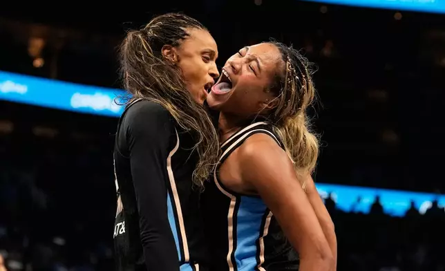 Atlanta Dream forward Brionna Jones (24) and Atlanta Dream guard Rhyne Howard (10) react after a foul during the second half of Game 3 of the WNBA basketball finals against the Golden State Valkyries on Wednesday, Oct. 21, 2026, in Atlanta. (AP Photo/Brynn Anderson)