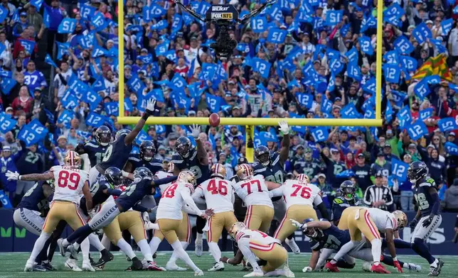 San Francisco 49ers kicker Eddy Pineiro (18) boots a field goal against the Seattle Seahawks during the second half of an NFL football game Sunday, Oct. 11, 2026, in Seattle. (AP Photo/Stephen Brashear)