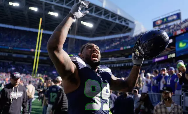 Seattle Seahawks defensive end Leonard Williams reacts toward supporters prior to an NFL football game against the San Francisco 49ers, in Seattle, Sunday, Oct. 11, 2026. (AP Photo/Stephen Brashear)