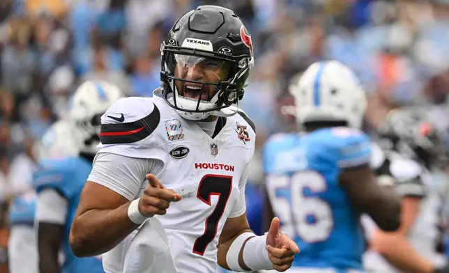 Houston Texans quarterback C.J. Stroud celebrates after running the ball for a touchdown during the second half of an NFL football game against the Tennessee Titans in Nashville, Tenn., Sunday, Oct. 11, 2026. (AP Photo/John Amis)