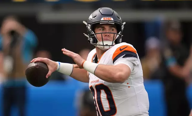Denver Broncos quarterback Bo Nix passes during the first half of an NFL football game against the Los Angeles Chargers, Sunday, Oct. 11, 2026, in Inglewood, Calif. (AP Photo/Gregory Bull)