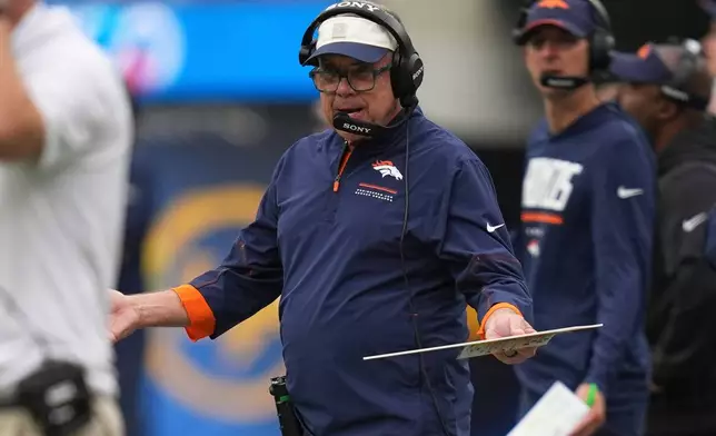 Denver Broncos head coach Sean Payton gestures from the sideline during the first half of an NFL football game against the Los Angeles Chargers, Sunday, Oct. 11, 2026, in Inglewood, Calif. (AP Photo/Gregory Bull)
