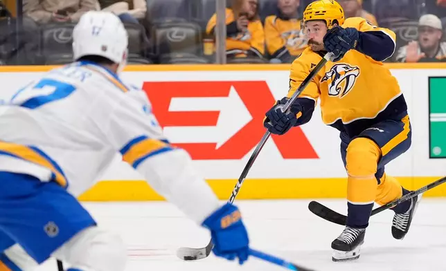 Nashville Predators left wing Filip Forsberg (9) shoots the puck during the second period of an NHL hockey game against the St. Louis Blues, Saturday, Oct. 17, 2026, in Nashville, Tenn. (AP Photo/George Walker IV)