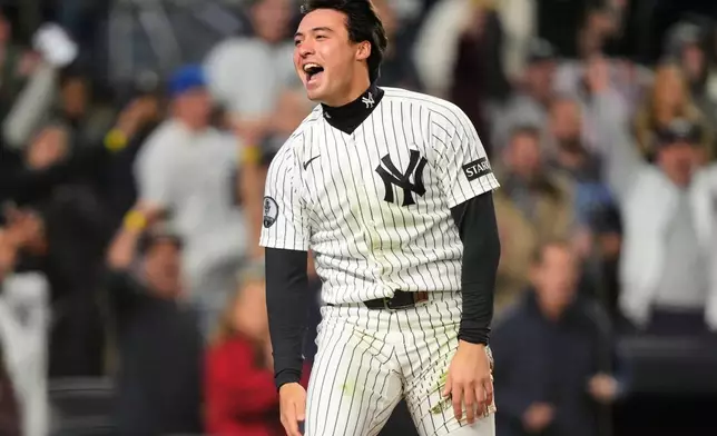 New York Yankees' Anthony Volpe celebrates after scoring on a Spencer Jones double during the fourth inning in Game 3 of baseball's American League Division Series against the Tampa Bay Rays, Wednesday, Oct. 7, 2026, in New York. (AP Photo/Yuki Iwamura)